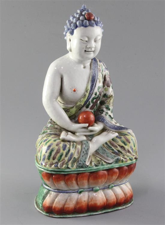 A Chinese enamelled porcelain seated figure of Buddha Shakyamuni, late 19th century, height 29.5cm